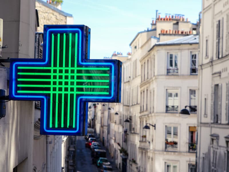 Medical cross of pharmacy in Paris Montmartre